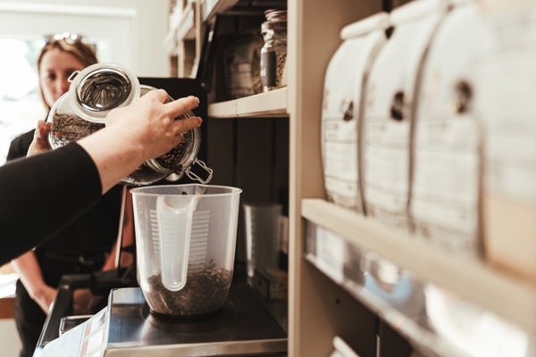 EDGE Coffee beans being poured into a Coffee Keep