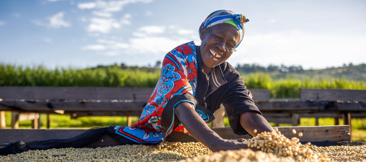 Kenyan Lady moving Beans