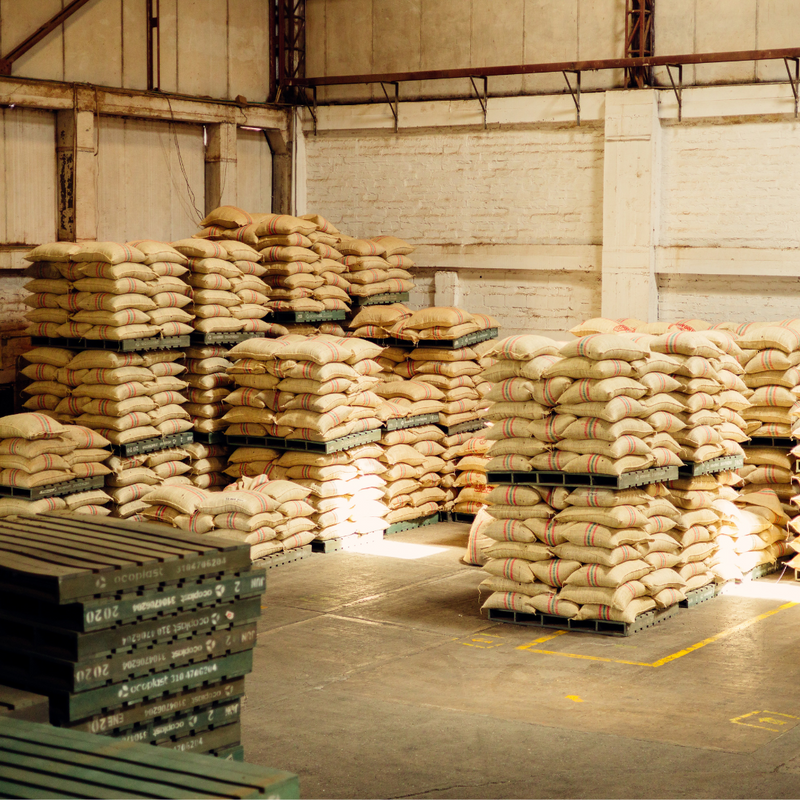 Stacks of coffee sacks in a warehouse 